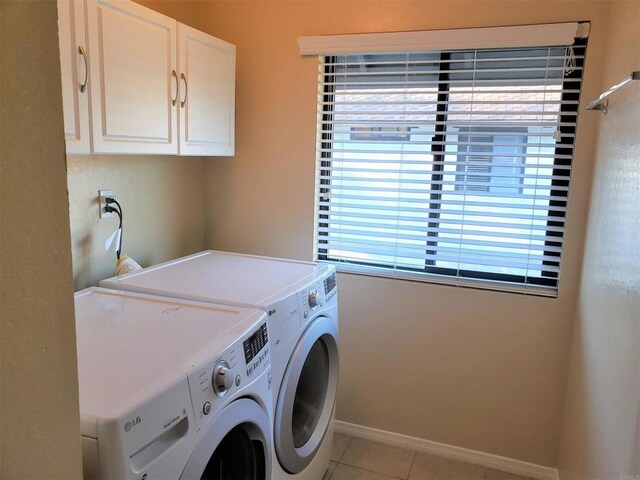 2556 Ocean Cove Dr, Cardiff By The Sea, CA 92007 - washroom featuring washing machine and dryer, cabinet space, and light tile patterned floors
