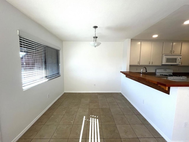 2556 Ocean Cove Dr, Cardiff By The Sea, CA 92007 - kitchen featuring white appliances, light tile patterned floors, decorative light fixtures, recessed lighting, and wooden counters