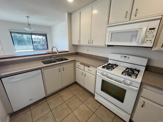 2556 Ocean Cove Dr, Cardiff By The Sea, CA 92007 - kitchen with white appliances, light tile patterned floors, white cabinetry, and hanging light fixtures