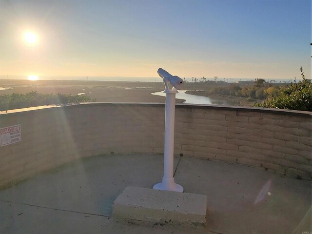 2556 Ocean Cove Dr, Cardiff By The Sea, CA 92007 - patio terrace at dusk featuring a water view