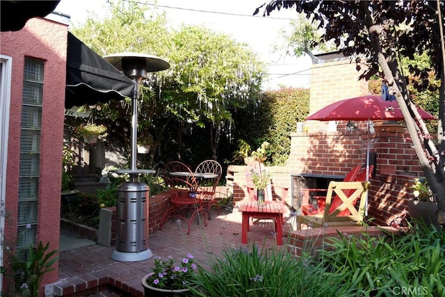734 Los Altos Ave, Long Beach, CA 90804 - view of patio / terrace featuring exterior fireplace and outdoor dining space