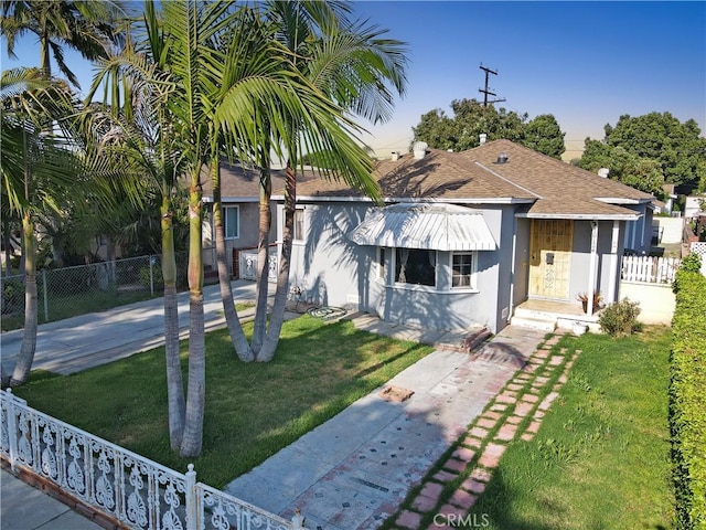 10124 San Anselmo Ave, South Gate, CA 90280 - view of front of home with stucco siding and a shingled roof