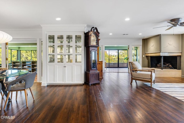 1245 S Orange Grove Blvd Unit 5, Pasadena, CA 91105 - living room featuring a fireplace, ornamental molding, plenty of natural light, dark wood-type flooring, and recessed lighting