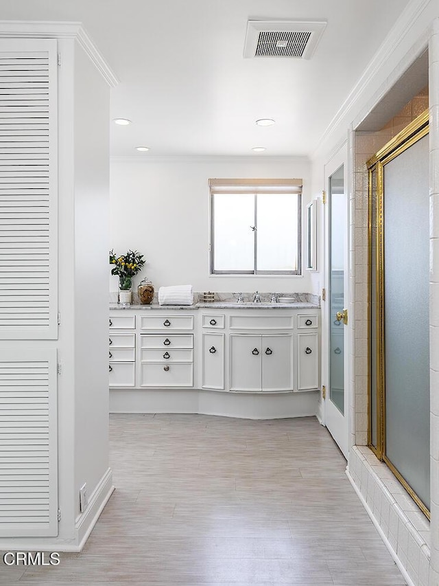 1245 S Orange Grove Blvd Unit 5, Pasadena, CA 91105 - bathroom featuring vanity, a stall shower, crown molding, wood finished floors, and recessed lighting