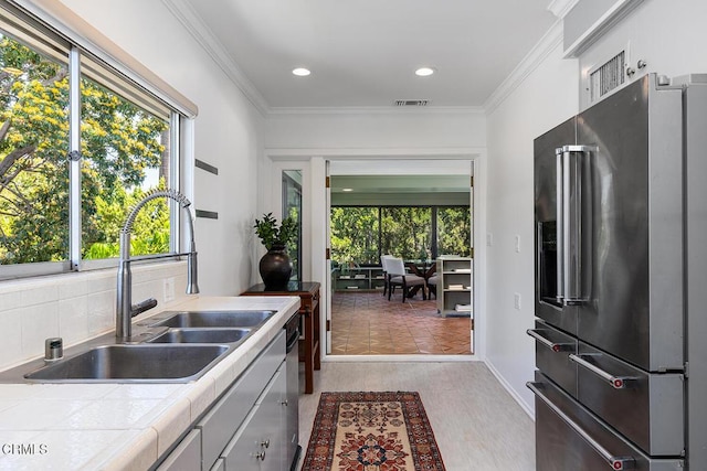 1245 S Orange Grove Blvd Unit 5, Pasadena, CA 91105 - kitchen featuring high end refrigerator, tile countertops, crown molding, and recessed lighting