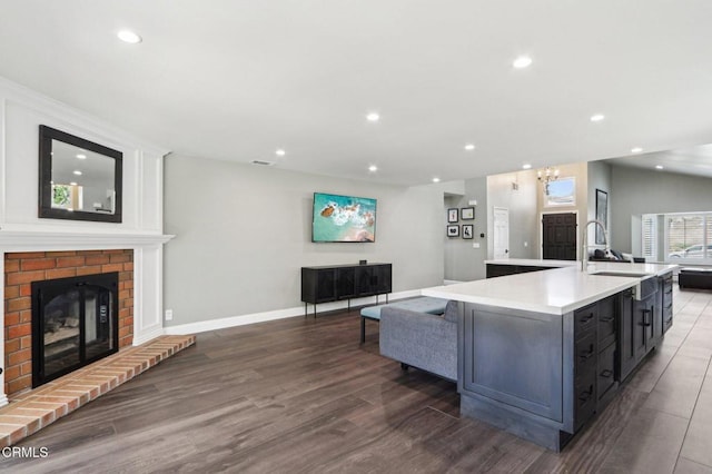 5406 Luis Dr, Agoura Hills, CA 91301 - kitchen featuring open floor plan, dark wood-style flooring, a kitchen island with sink, recessed lighting, and light countertops