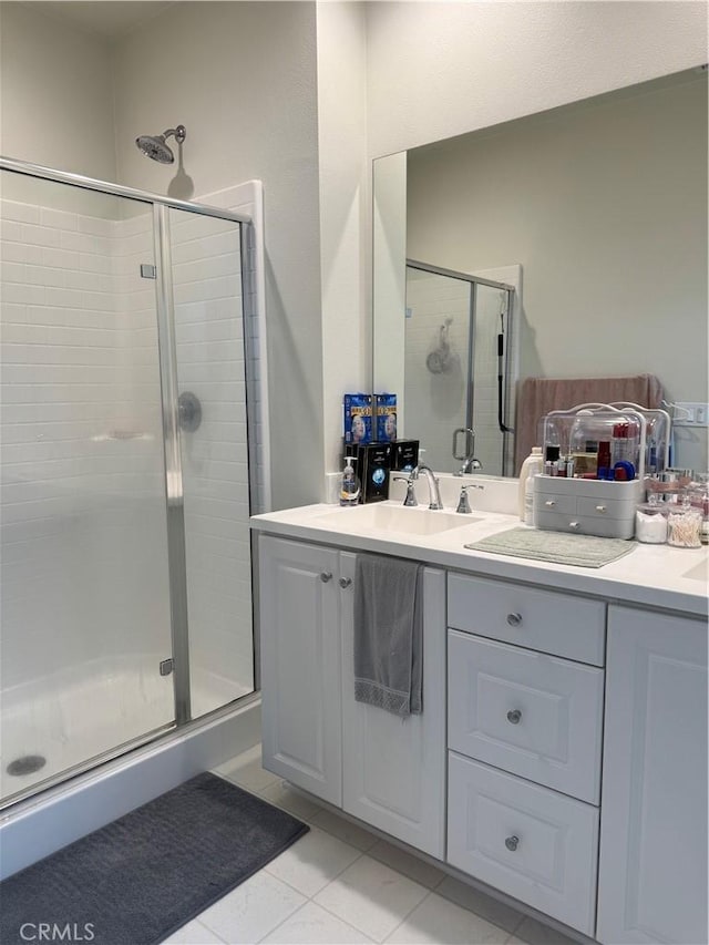 3641 E Moonlight St Unit 51, Ontario, CA 91761 - bathroom featuring a stall shower, double vanity, and tile patterned floors