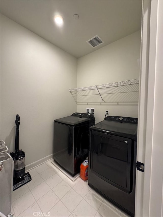3641 E Moonlight St Unit 51, Ontario, CA 91761 - washroom with washing machine and dryer and baseboards