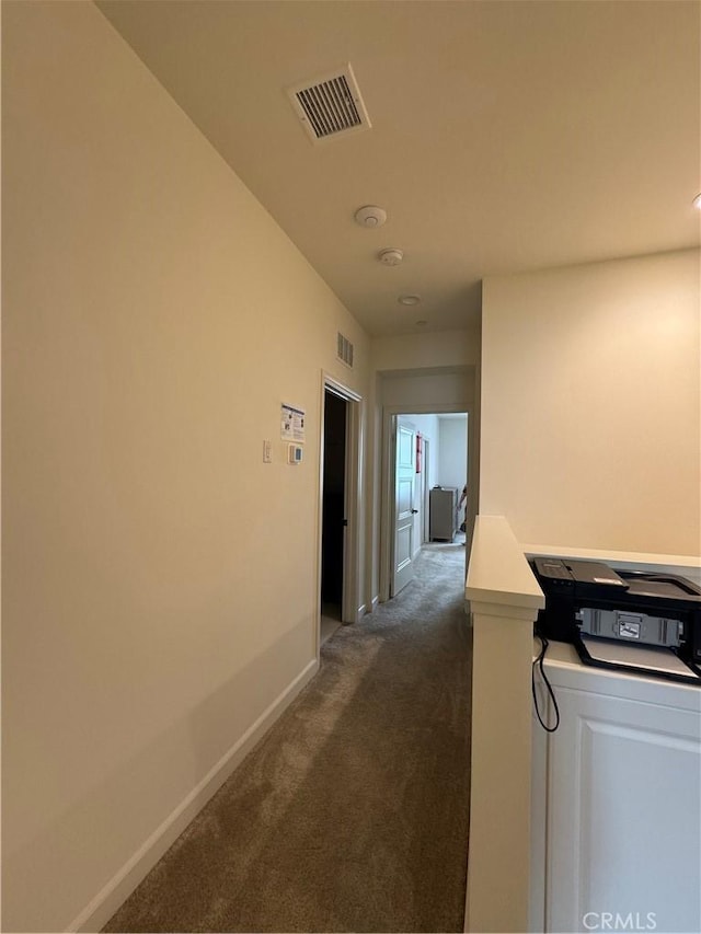 3641 E Moonlight St Unit 51, Ontario, CA 91761 - corridor with dark colored carpet and baseboards