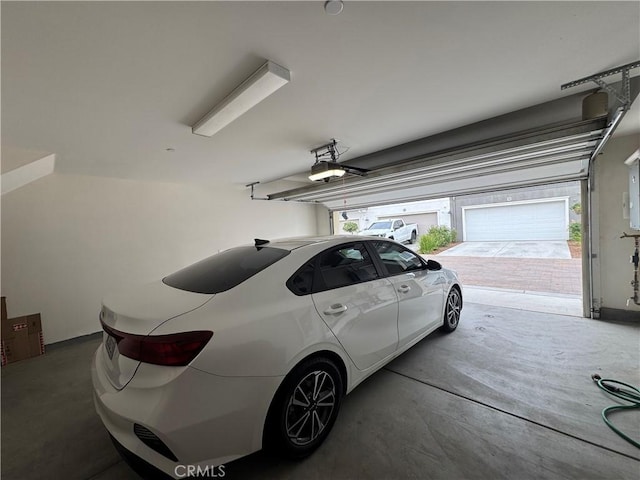 3641 E Moonlight St Unit 51, Ontario, CA 91761 - garage featuring a garage door opener