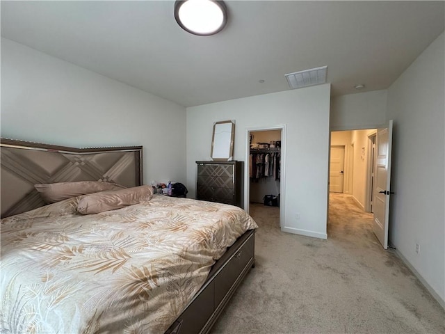 3641 E Moonlight St Unit 51, Ontario, CA 91761 - bedroom with light carpet, a walk in closet, a closet, and baseboards