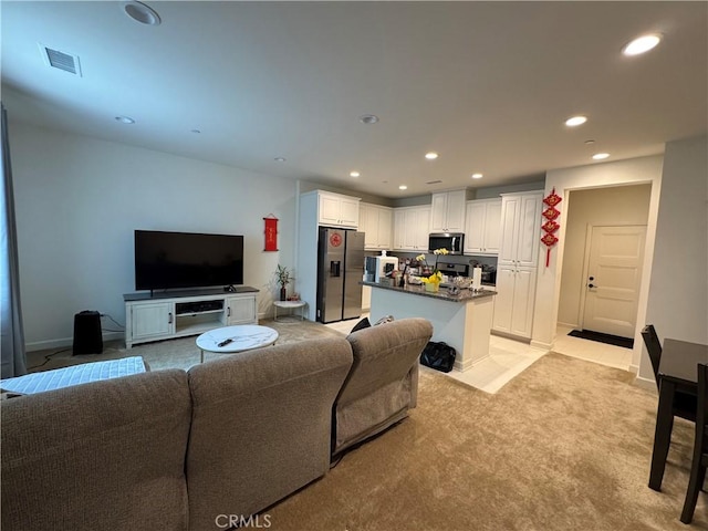 3641 E Moonlight St Unit 51, Ontario, CA 91761 - living room featuring recessed lighting, light carpet, and baseboards