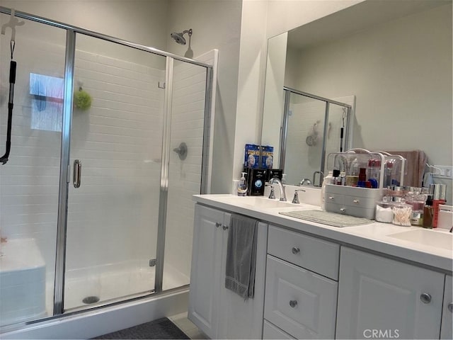 3641 E Moonlight St Unit 51, Ontario, CA 91761 - bathroom featuring double vanity and a shower stall