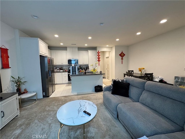 3641 E Moonlight St Unit 51, Ontario, CA 91761 - living room featuring light colored carpet and recessed lighting