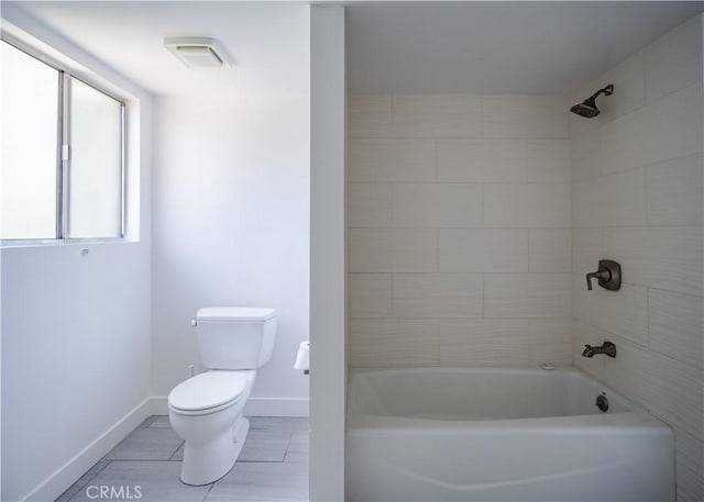 1522 N Benton Way, Los Angeles, CA 90026 - bathroom featuring toilet, baseboards, and tub / shower combination