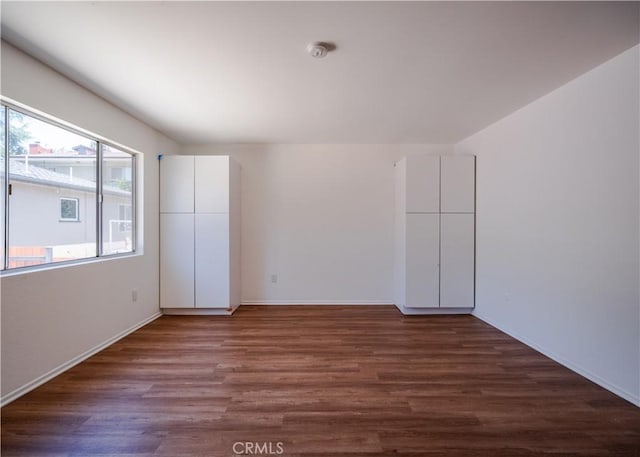 1522 N Benton Way, Los Angeles, CA 90026 - unfurnished room featuring wood finished floors, baseboards, and a smoke detector