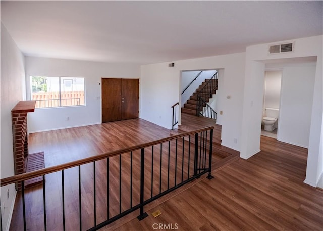 1522 N Benton Way, Los Angeles, CA 90026 - hall featuring wood finished floors, baseboards, and stairs