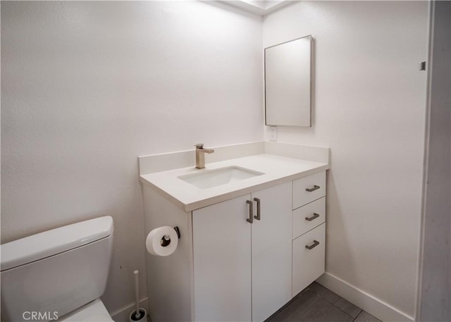 1522 N Benton Way, Los Angeles, CA 90026 - half bathroom featuring vanity, toilet, and tile patterned floors
