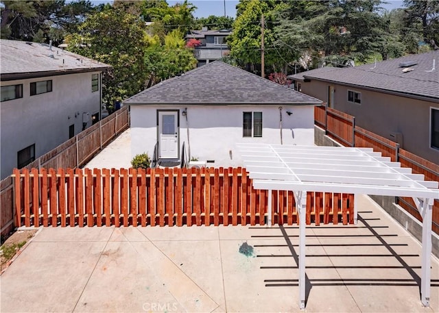 1522 N Benton Way, Los Angeles, CA 90026 - back of house featuring stairway, stucco siding, and a shingled roof