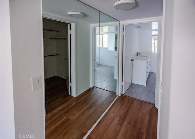 1522 N Benton Way, Los Angeles, CA 90026 - hall featuring wood finished floors, a sink, baseboards, and plenty of natural light