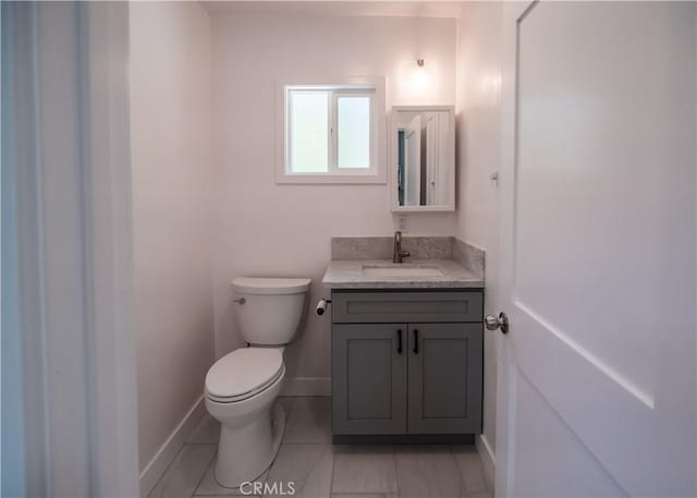 1522 N Benton Way, Los Angeles, CA 90026 - half bath with toilet, vanity, baseboards, and tile patterned floors