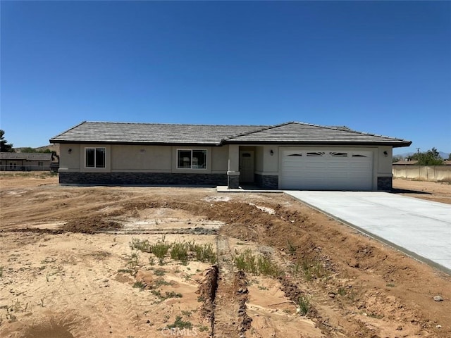 15737 Sago Rd, Apple Valley, CA 92307 - ranch-style home featuring an attached garage, driveway, and stucco siding