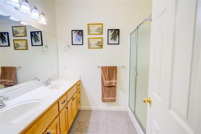 9713 Rastro Way, La Grange, CA 95329 - bathroom featuring double vanity, a shower with door, and baseboards