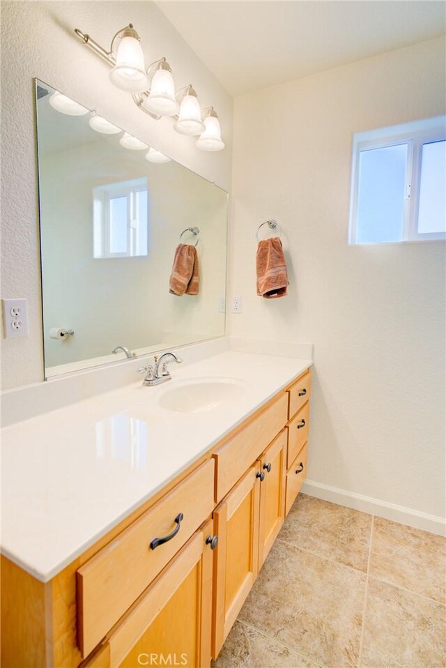 9713 Rastro Way, La Grange, CA 95329 - bathroom featuring vanity, plenty of natural light, baseboards, and tile patterned flooring