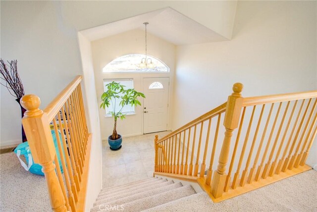 9713 Rastro Way, La Grange, CA 95329 - stairway with a chandelier, high vaulted ceiling, and baseboards