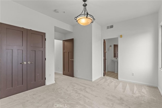809 Meridian Ave Unit U, South Pasadena, CA 91030 - unfurnished bedroom featuring carpet, baseboards, ensuite bath, and a sink