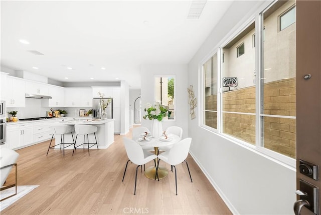 149 Carmine, Irvine, CA 92618 - dining area with light wood-style flooring, baseboards, and recessed lighting