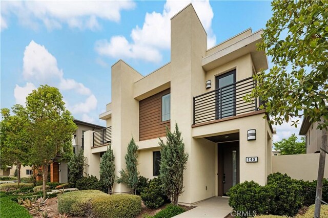149 Carmine, Irvine, CA 92618 - view of front of house with a balcony and stucco siding
