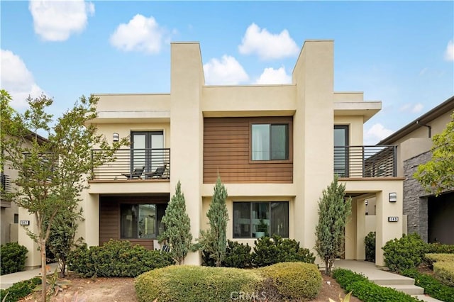 149 Carmine, Irvine, CA 92618 - view of front of house with a balcony and stucco siding