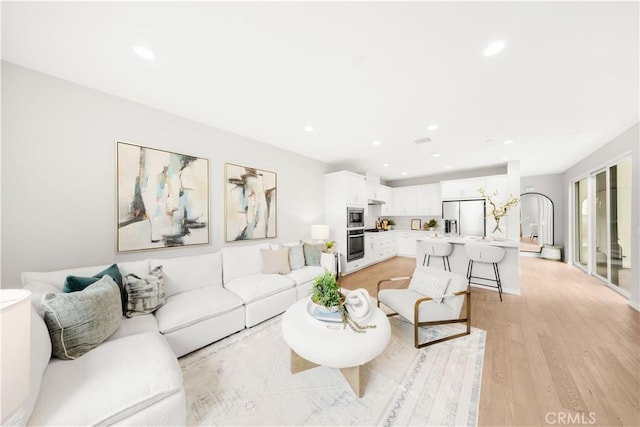 149 Carmine, Irvine, CA 92618 - living area with light wood-style floors and recessed lighting