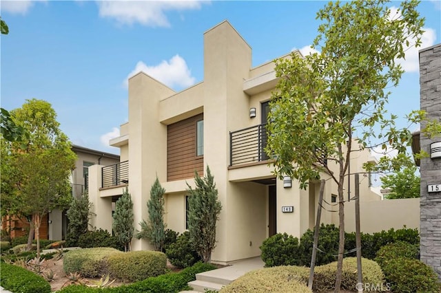 149 Carmine, Irvine, CA 92618 - view of front of home featuring a balcony and stucco siding