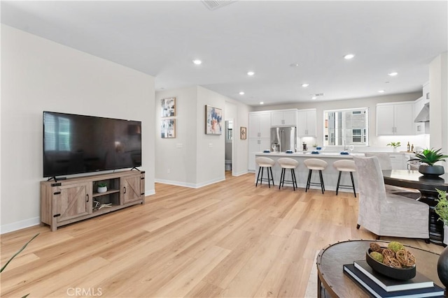 25 Splendor Way, Rancho Mission Viejo, CA 92694 - living room featuring light wood-style floors, baseboards, and recessed lighting