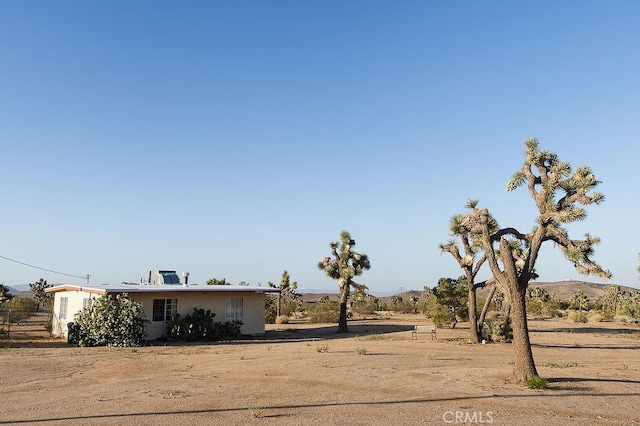 58382 Sunny Sands Dr, Yucca Valley, CA 92284 - view of front of property with stucco siding