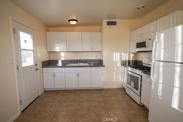 58382 Sunny Sands Dr, Yucca Valley, CA 92284 - kitchen with white appliances, a sink, white cabinetry, baseboards, and light tile patterned flooring