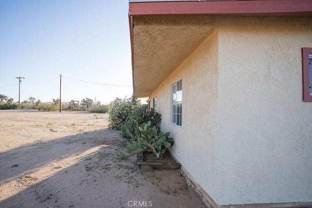 58382 Sunny Sands Dr, Yucca Valley, CA 92284 - view of side of property with stucco siding