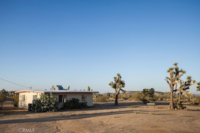 58382 Sunny Sands Dr, Yucca Valley, CA 92284 - view of front of home with stucco siding