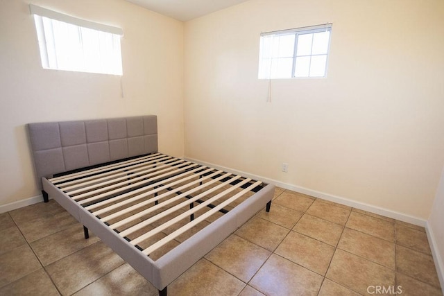 58382 Sunny Sands Dr, Yucca Valley, CA 92284 - unfurnished bedroom featuring tile patterned floors and baseboards