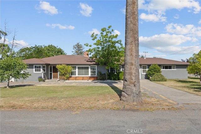 4436 County Road M 1/2, Orland, CA 95963 - ranch-style house featuring a front yard, a chimney, and driveway