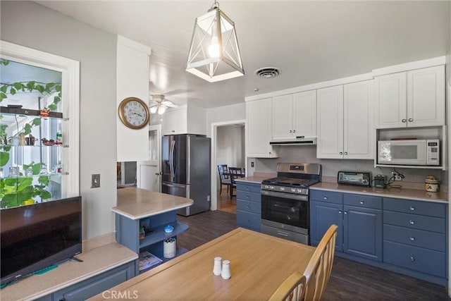 4436 County Road M 1/2, Orland, CA 95963 - kitchen with stainless steel appliances, under cabinet range hood, blue cabinetry, white cabinetry, and light countertops