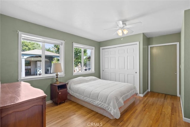 4436 County Road M 1/2, Orland, CA 95963 - bedroom featuring light wood finished floors, baseboards, a closet, and ceiling fan