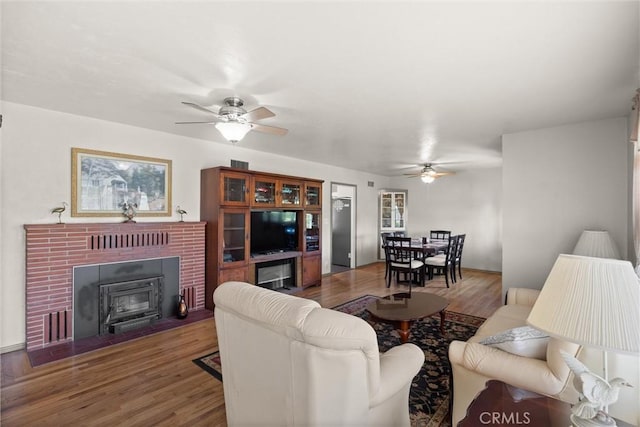 4436 County Road M 1/2, Orland, CA 95963 - living room featuring a ceiling fan, wood finished floors, and a brick fireplace