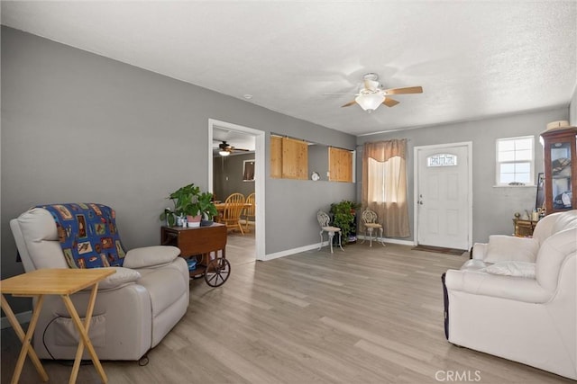 4436 County Road M 1/2, Orland, CA 95963 - living area featuring a ceiling fan, light wood-style floors, and baseboards