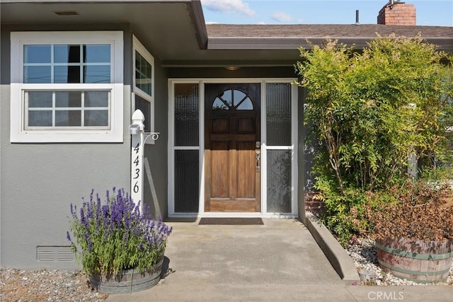 4436 County Road M 1/2, Orland, CA 95963 - doorway to property with stucco siding and a chimney