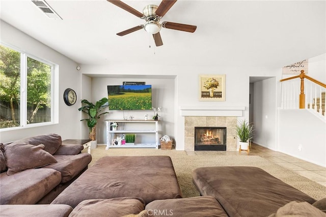 29778 Salmon St, Menifee, CA 92584 - living room featuring a ceiling fan, stairs, a fireplace, and tile patterned flooring