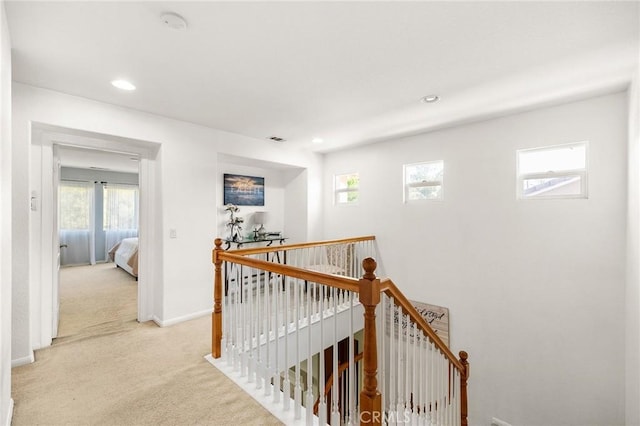 29778 Salmon St, Menifee, CA 92584 - hallway with an upstairs landing, light colored carpet, healthy amount of natural light, and recessed lighting