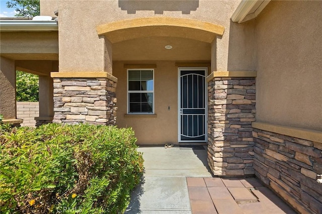 29778 Salmon St, Menifee, CA 92584 - view of exterior entry featuring stone siding and stucco siding
